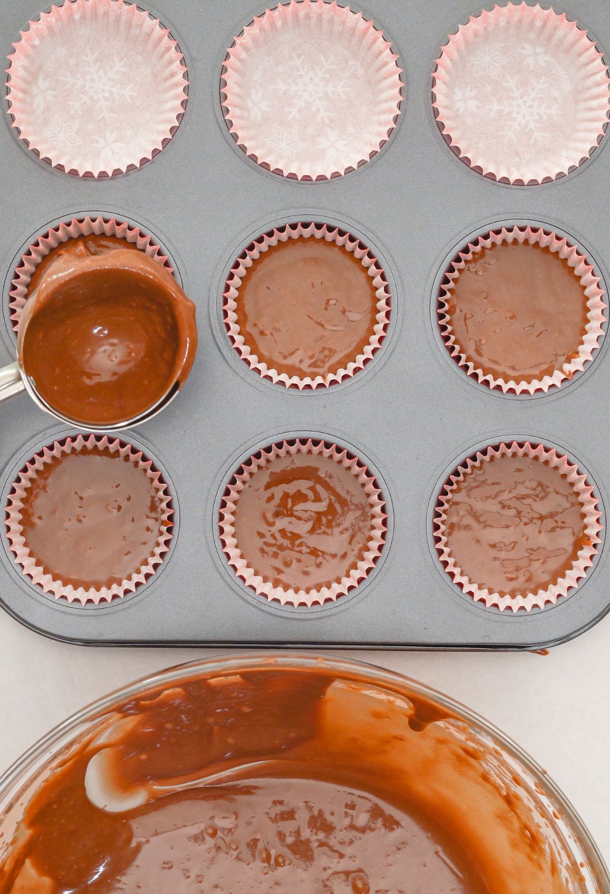 A cup of chocolate in a muffin tin.