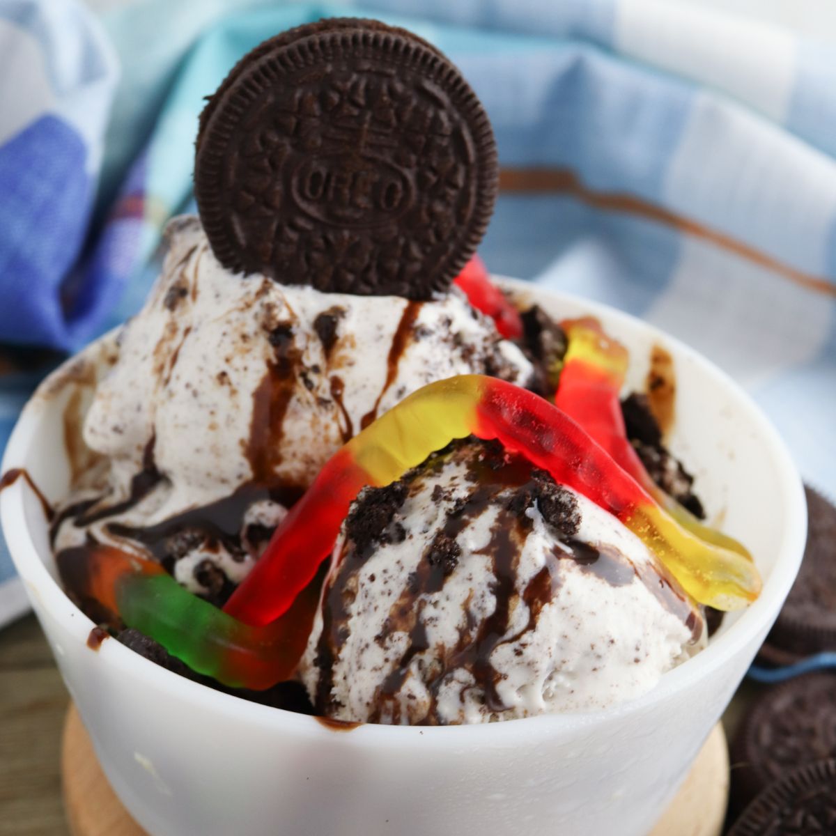 Oreo ice cream in a bowl with gummy bears.