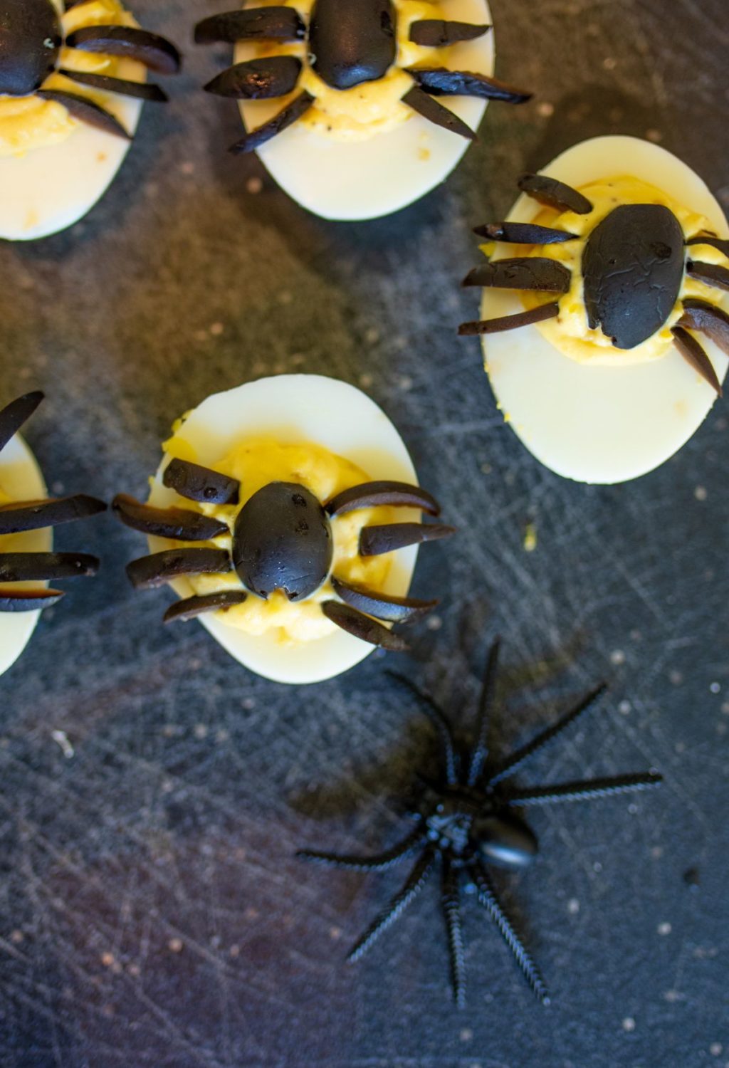 Spooky Halloween eggs with spider decorations.