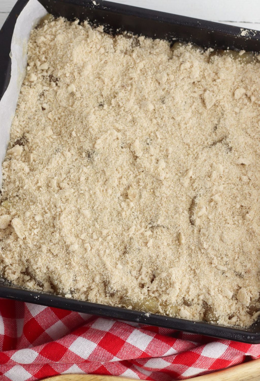 A baking dish with a crumb topping on it.