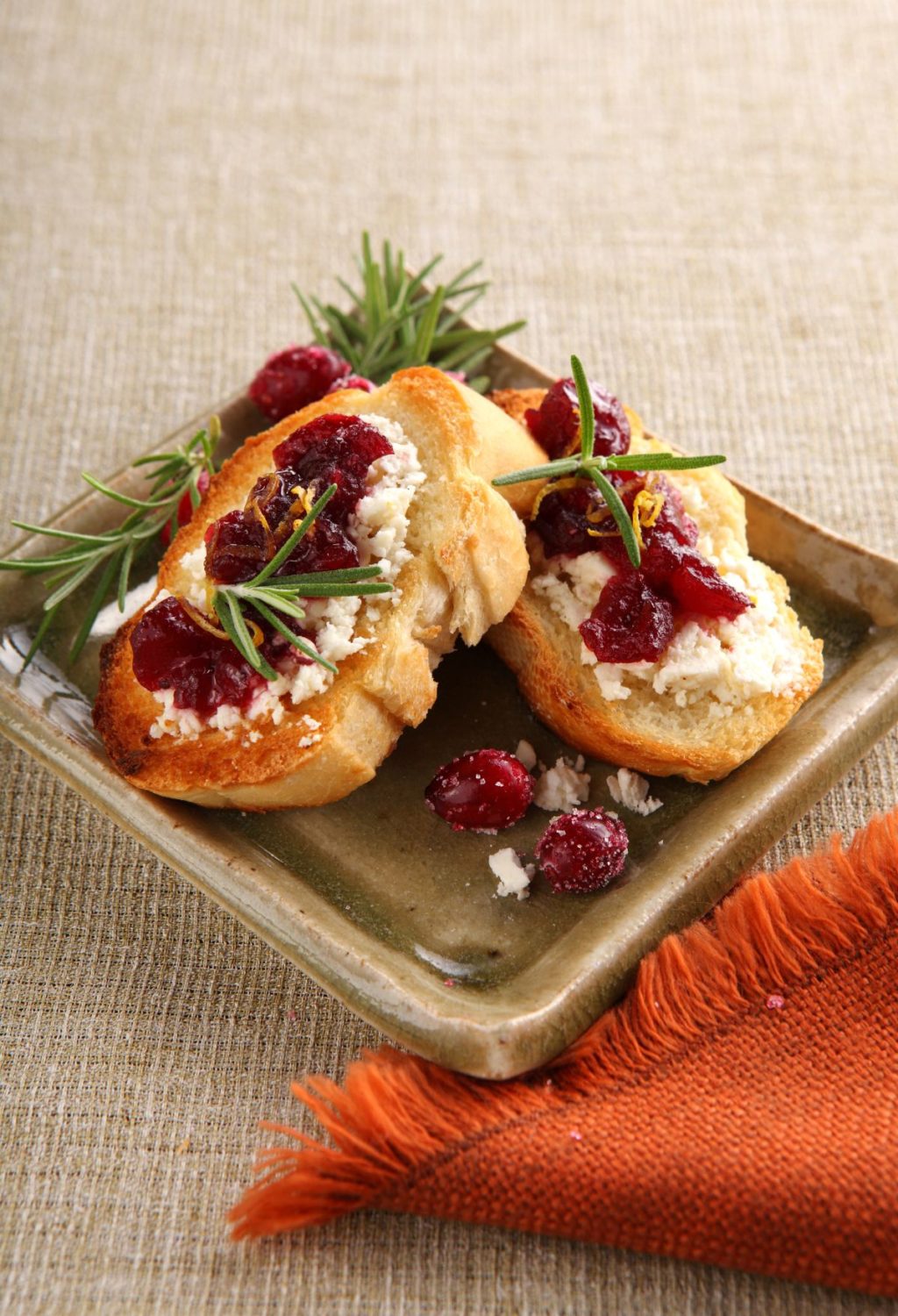 A plate with cranberry and goat cheese on it.