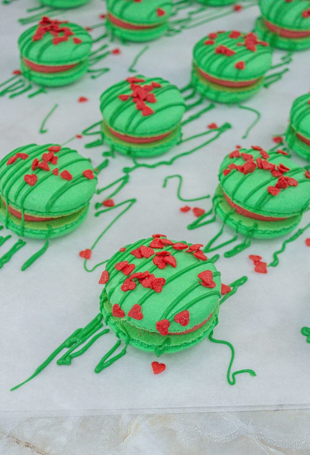 Christmas macarons with red and green sprinkles.