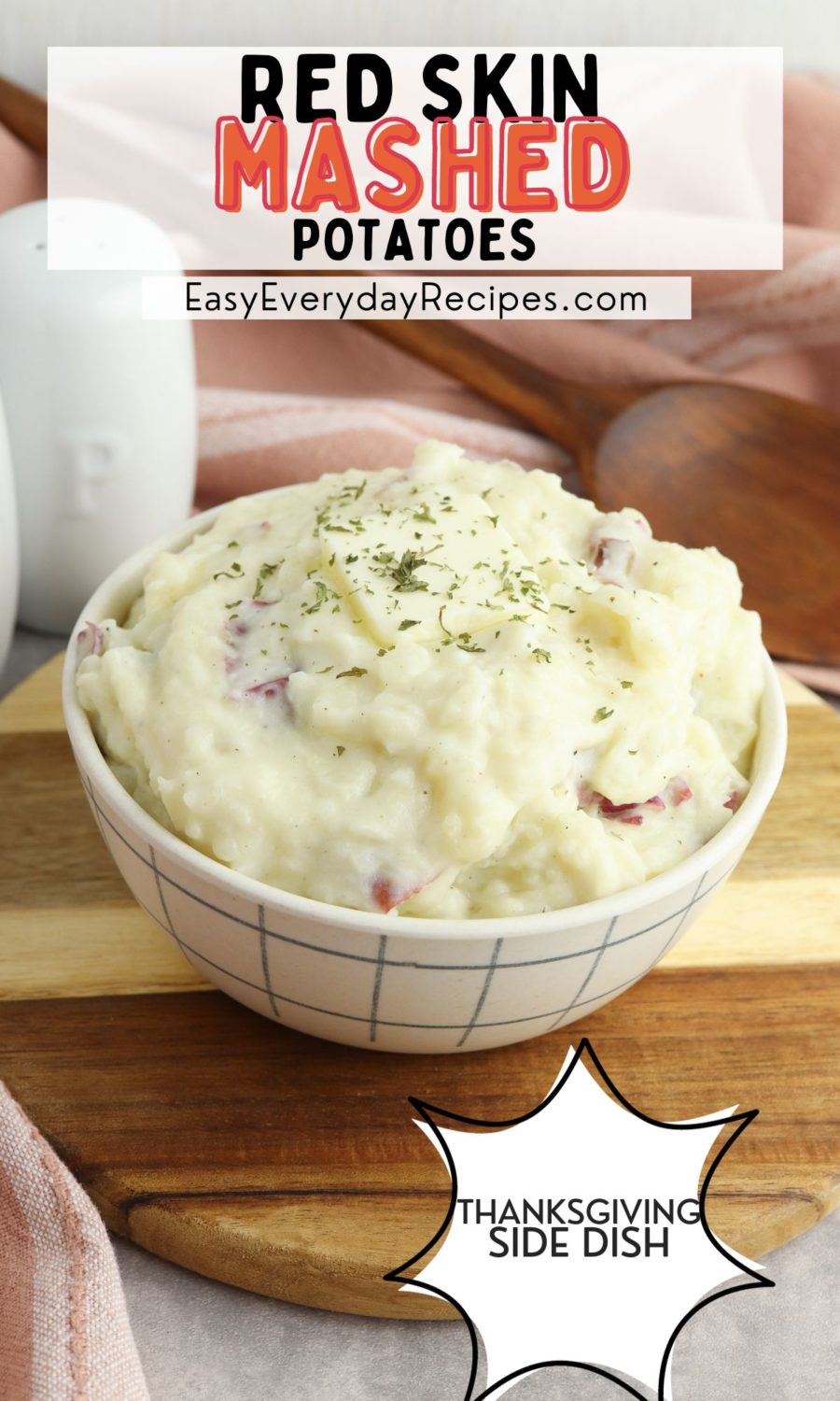 Red skin mashed potatoes on a white plate.