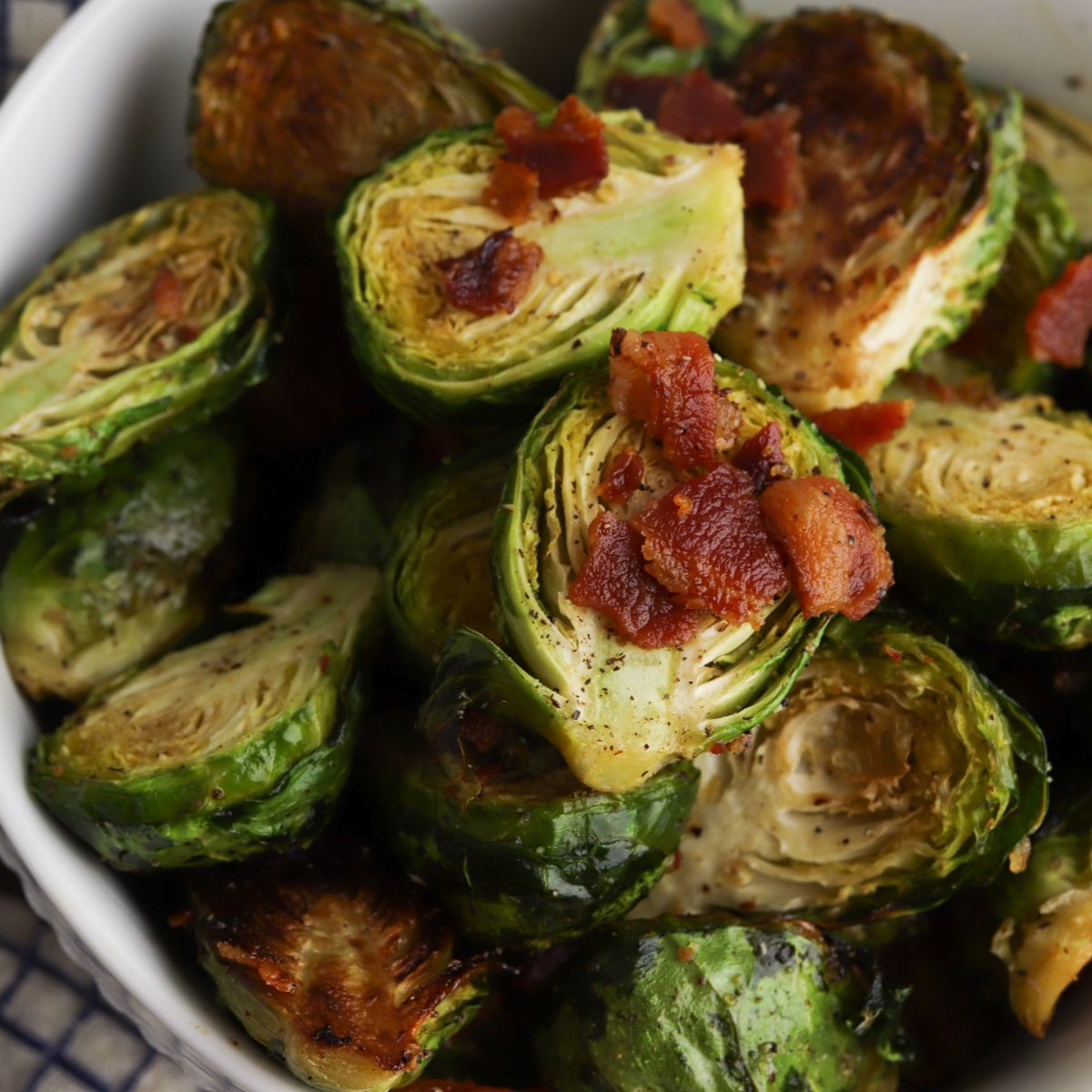 Roasted brussels sprouts with bacon in a bowl.
