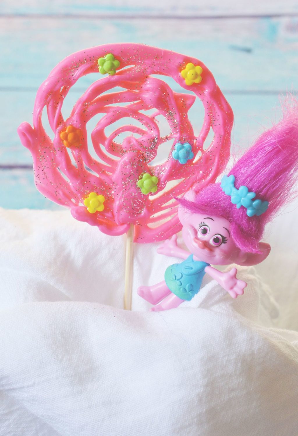 Trolls lollipops with a pink troll doll on top.