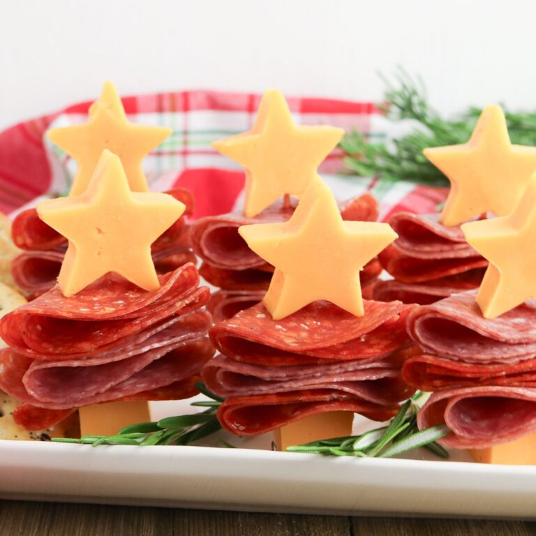 A plate of cheese and sausage christmas tree appetizers.
