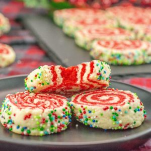 A plate of cookies with sprinkles on it.