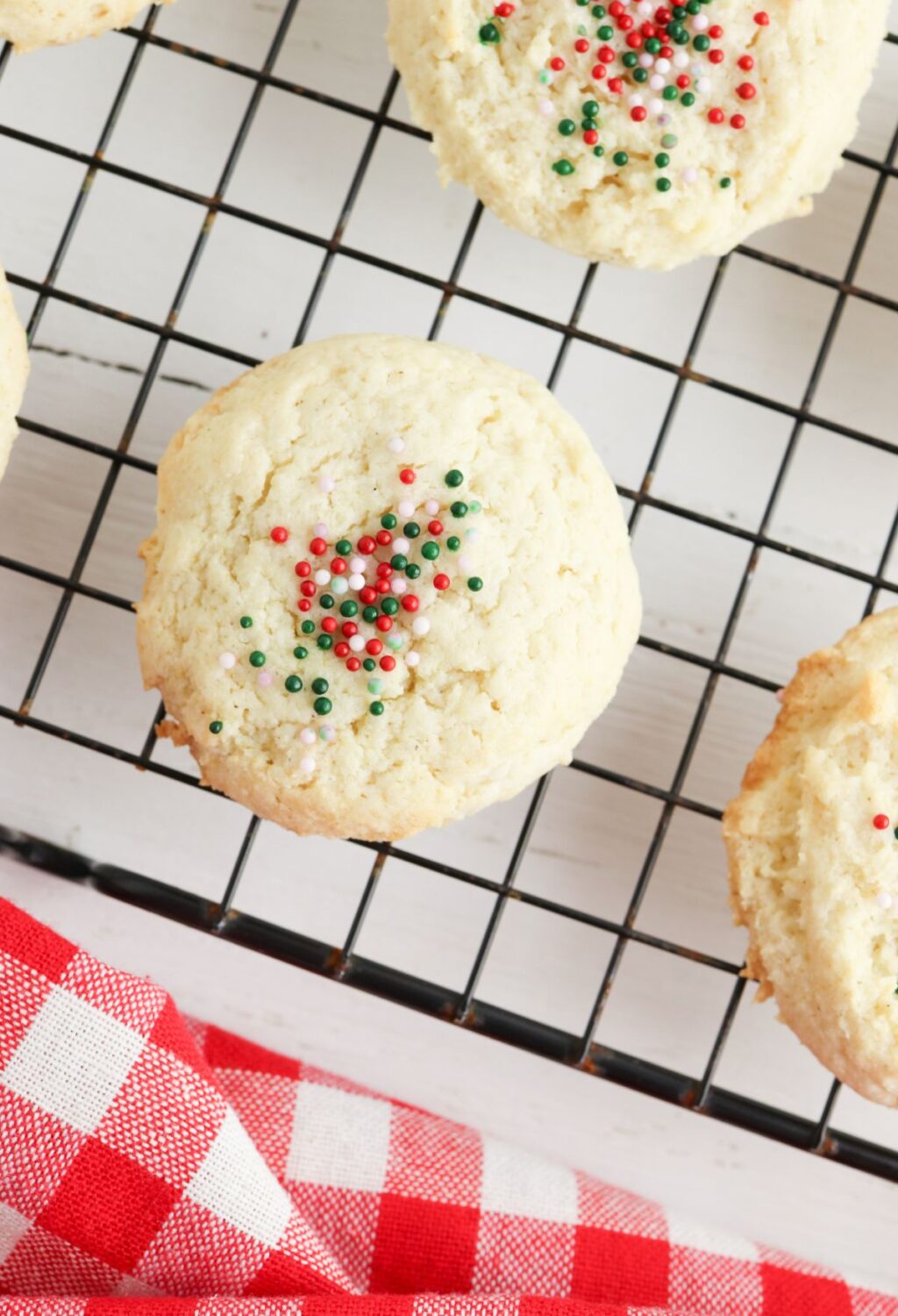 Cookies with sprinkles on a cooling rack.