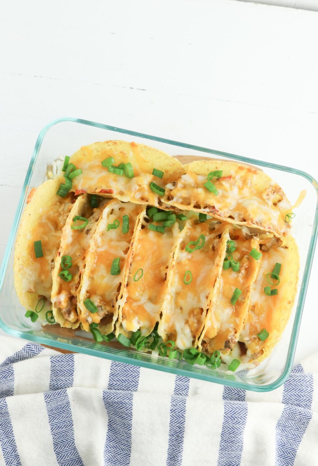 Chicken tacos in a glass baking dish.