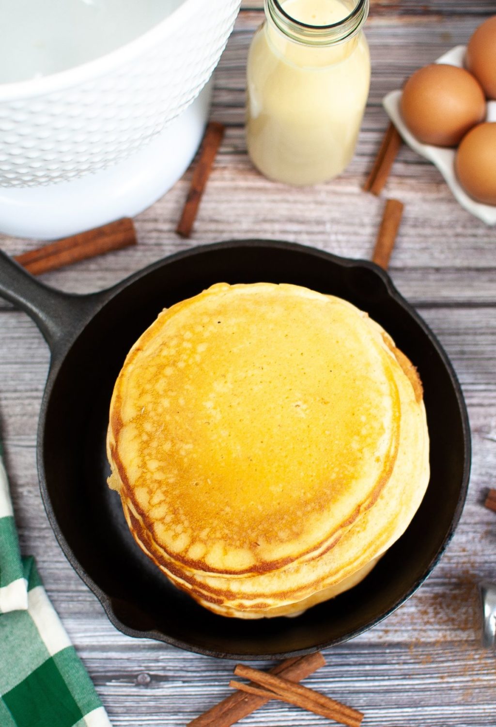 Pancakes in a skillet with cinnamon and eggs.