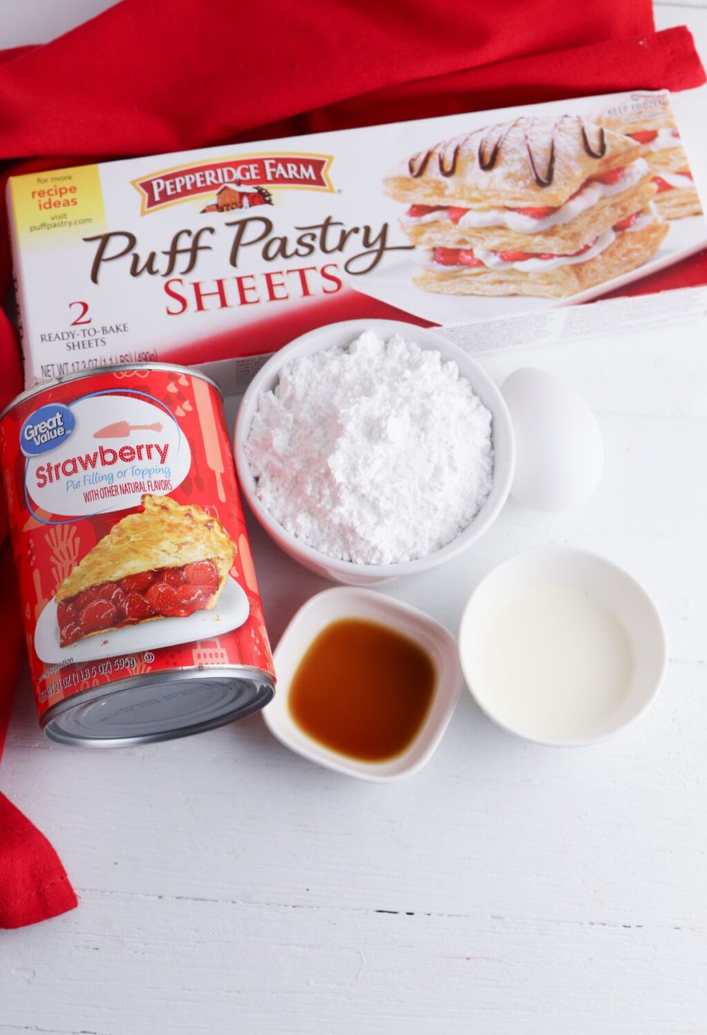 The ingredients for a puff pastry pie are on a table.