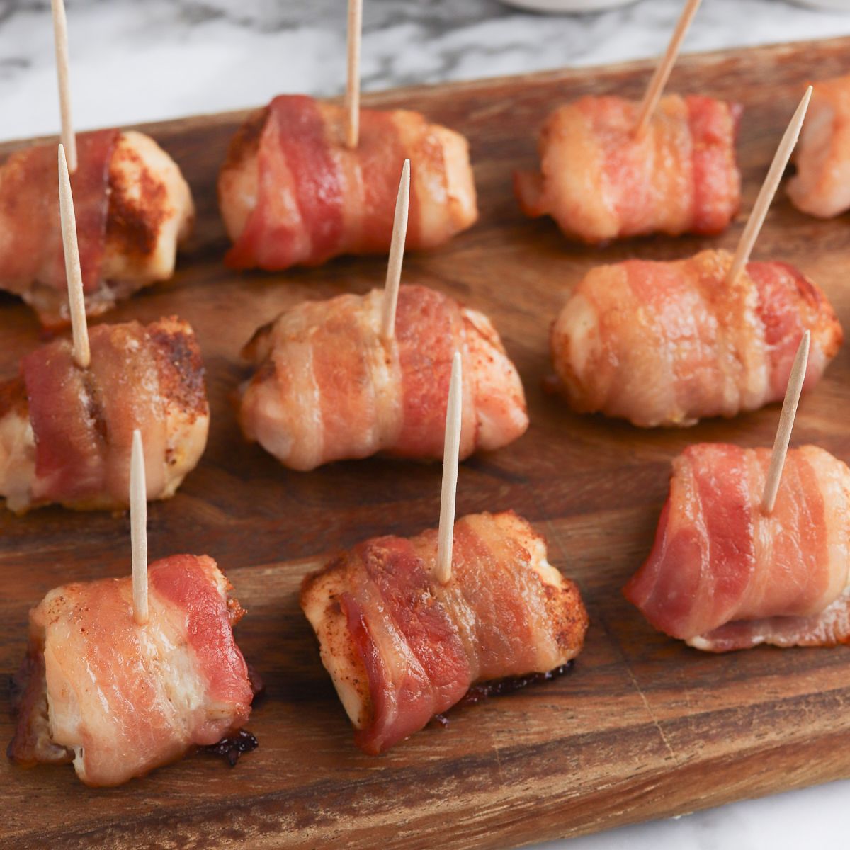 A tray of bacon wrapped chicken.