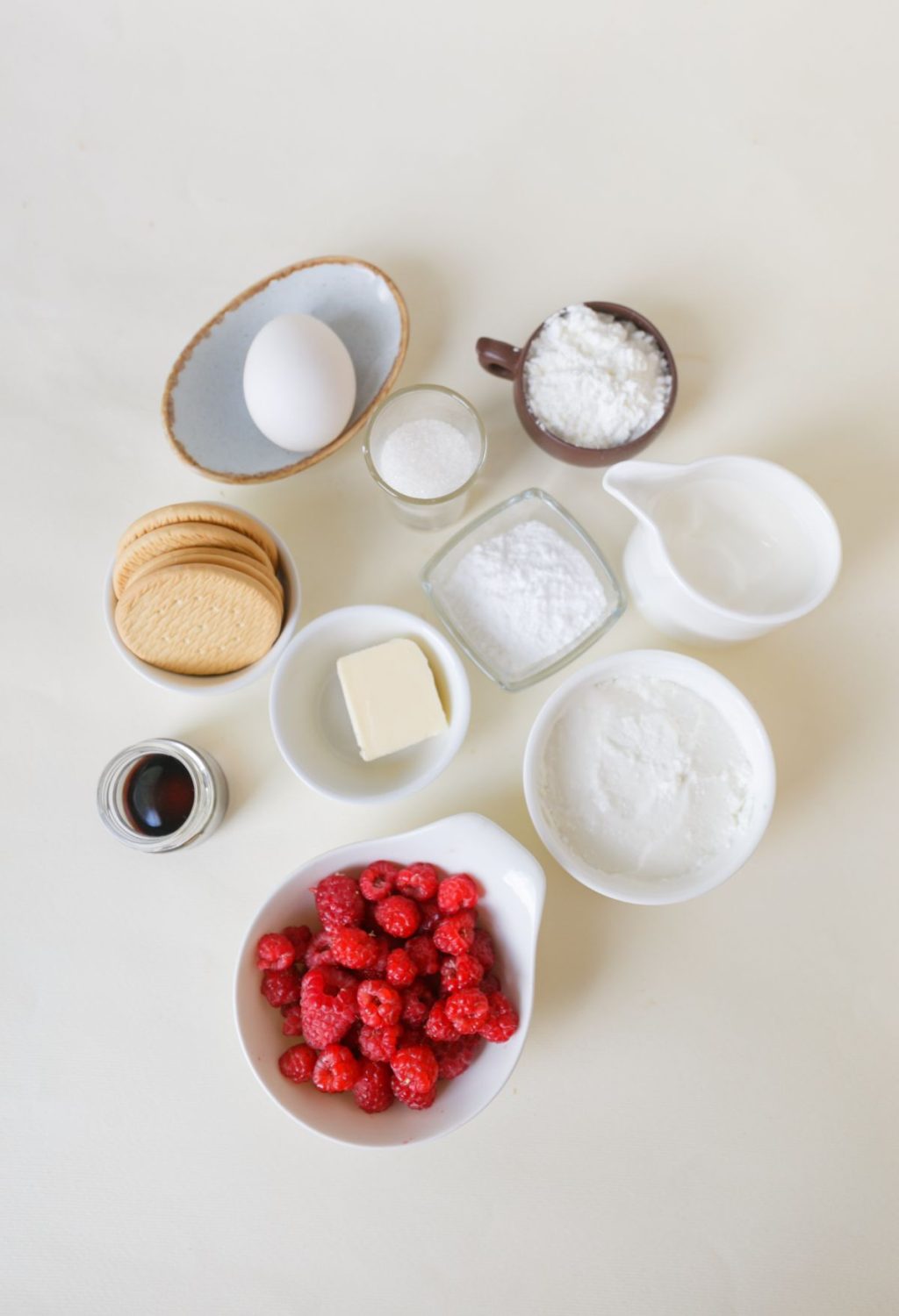 The ingredients for raspberry cookies are laid out on a table.