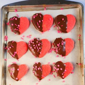 Valentine's day heart cookies on a baking sheet.