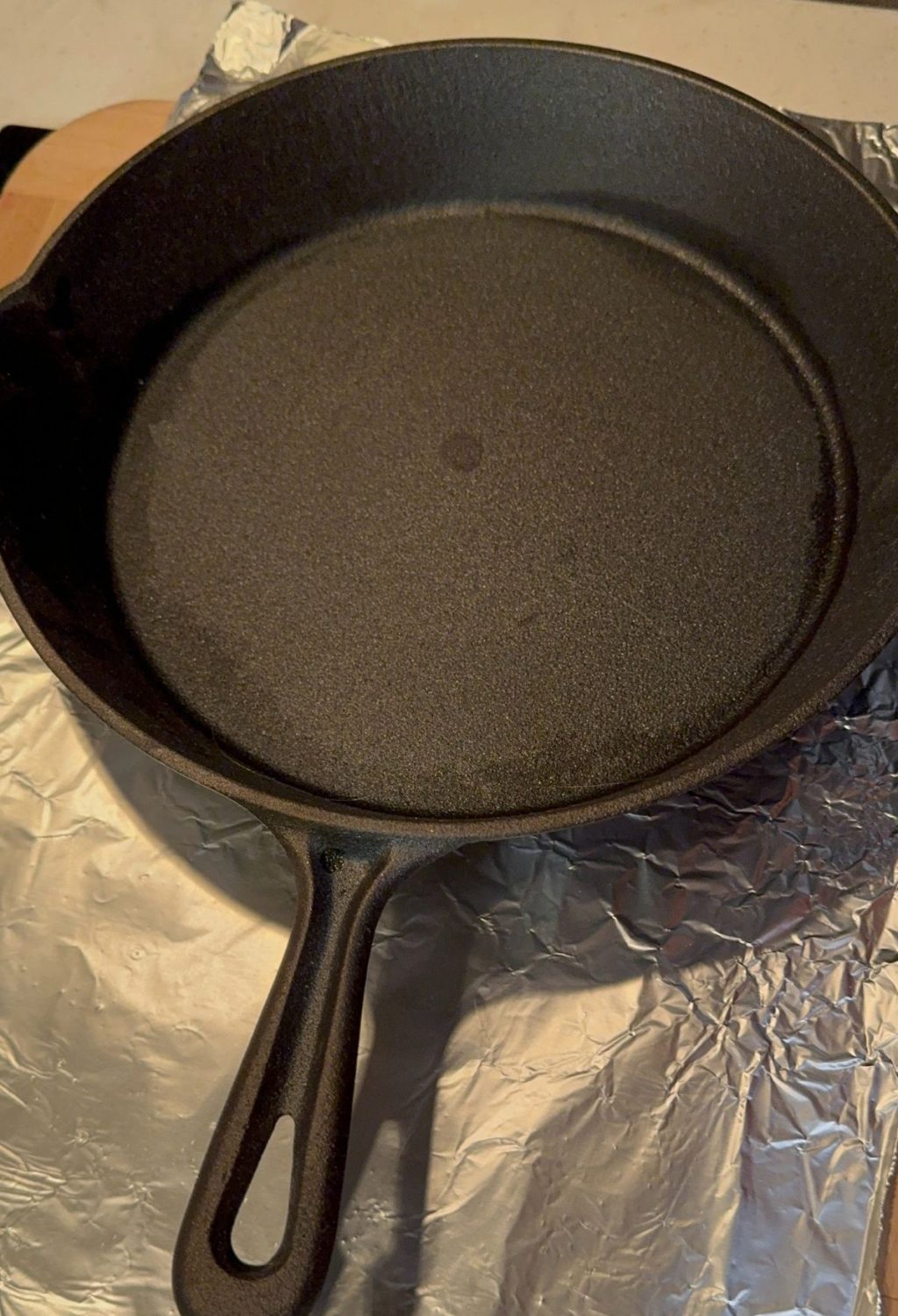 A black cast iron skillet on a table.