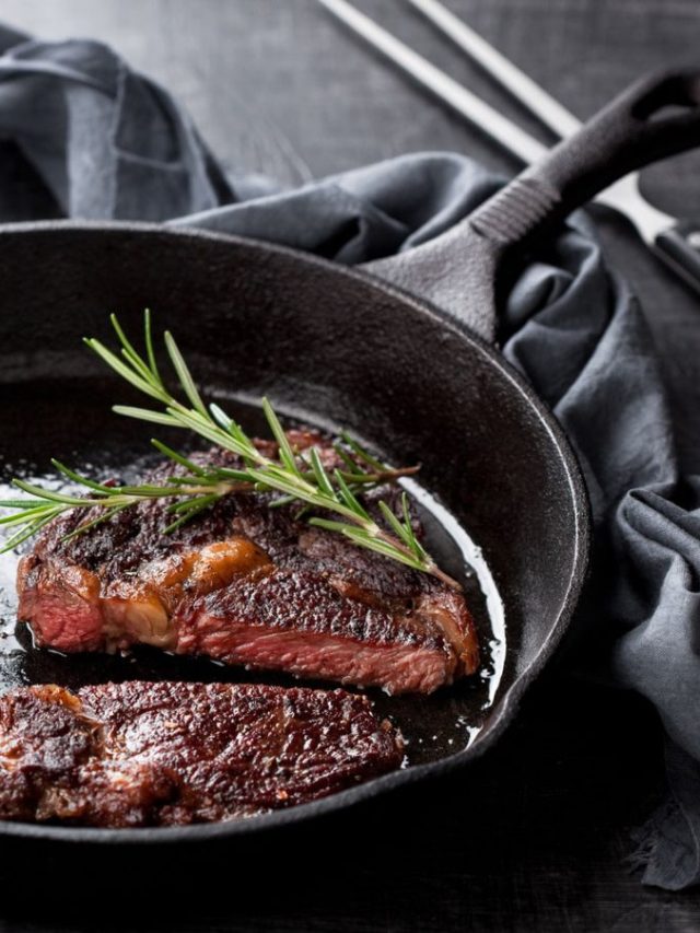 10 Foods Adults Feel Embarrassed to Order at Restaurants 2 Roasted beef ribeye steak in a cast iron frying pan, a selective focus