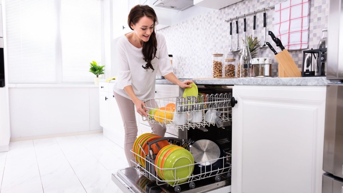 woman loading a dishwasher