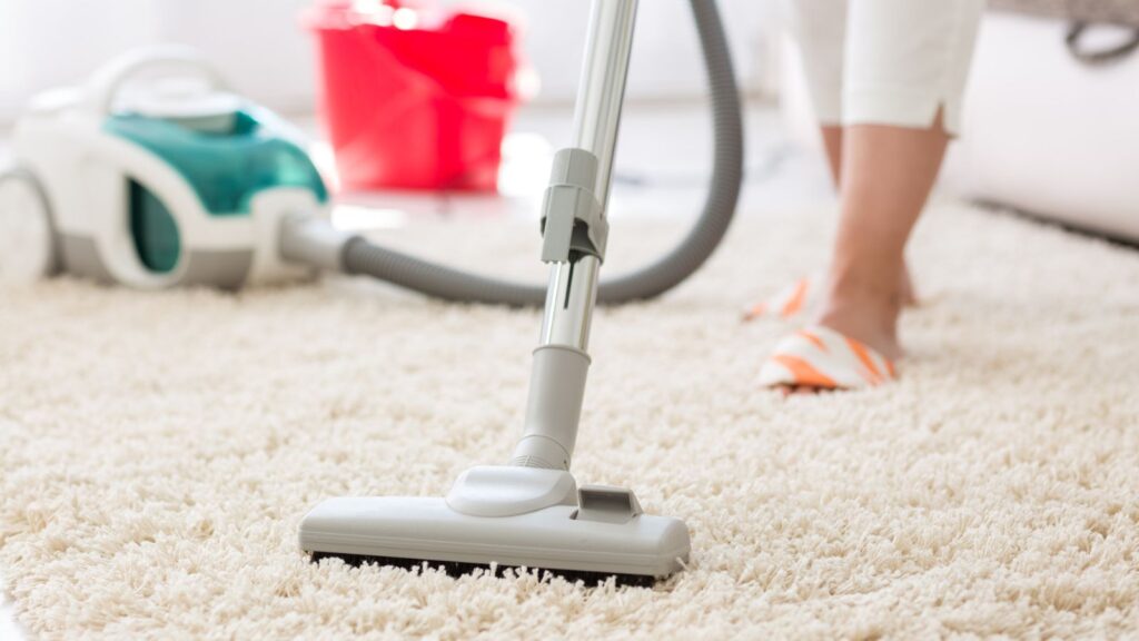 Suction grey carpet cleaning with vacuum cleaner