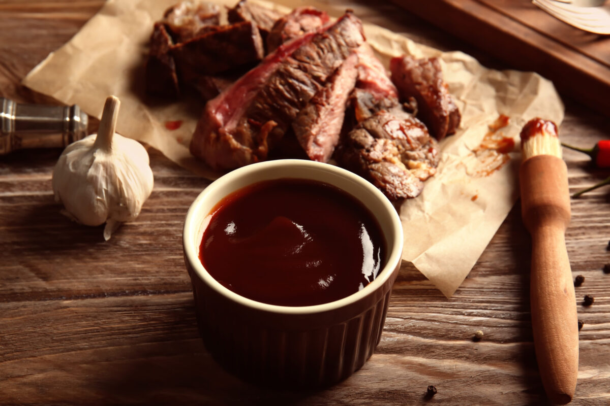 9 Fast Food Dipping Sauces That Can Ruin an Otherwise Good Order 1 Bowl with barbecue sauce on wooden table