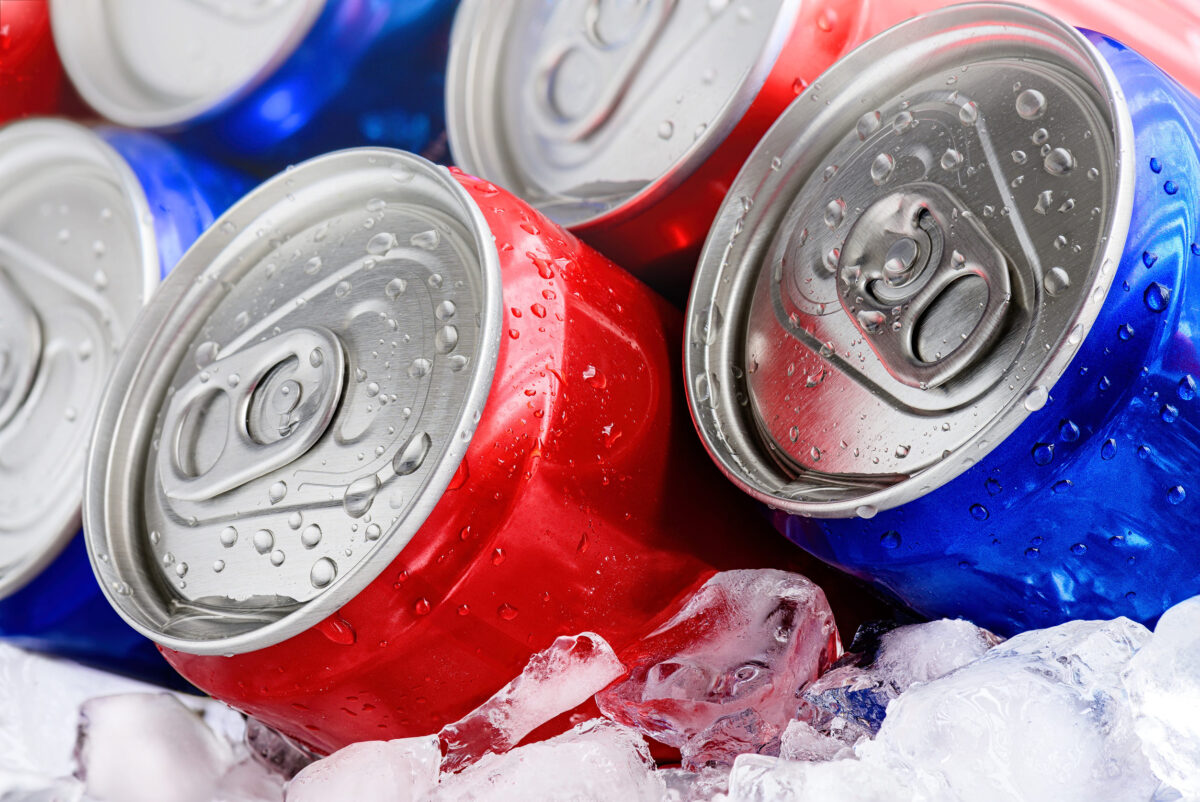 The worst drinks for cholesterol: Avoid these drinks if you want a Healthier Heart 1 Red and blue soda cans on ice with condensation