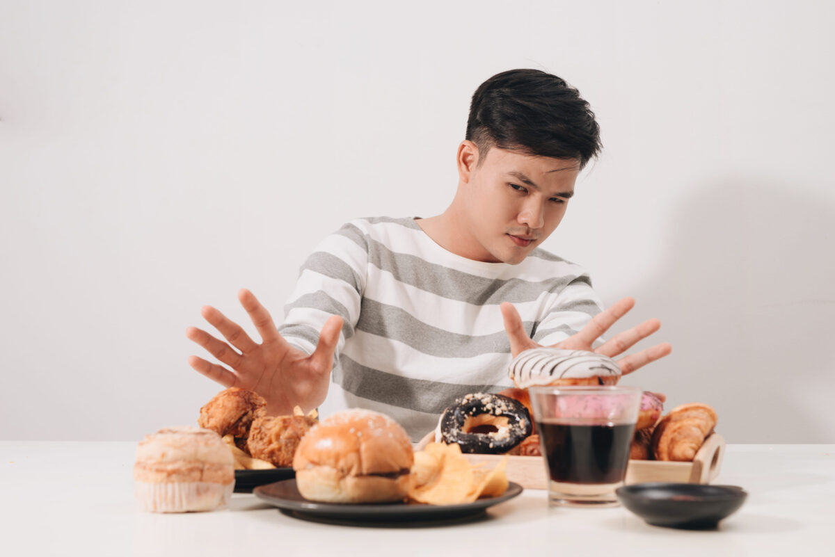 Young man in dieting and healthy eating concept