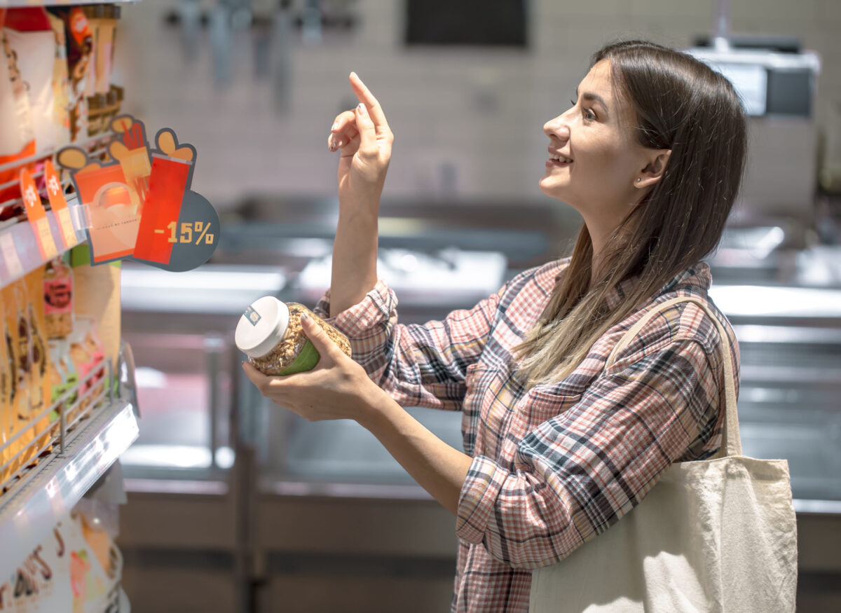 The 6 Truths About Sugar-Free Foods and Why They Could Be Worse Than You Think 4 Young girl chooses products from the counter in the store.
