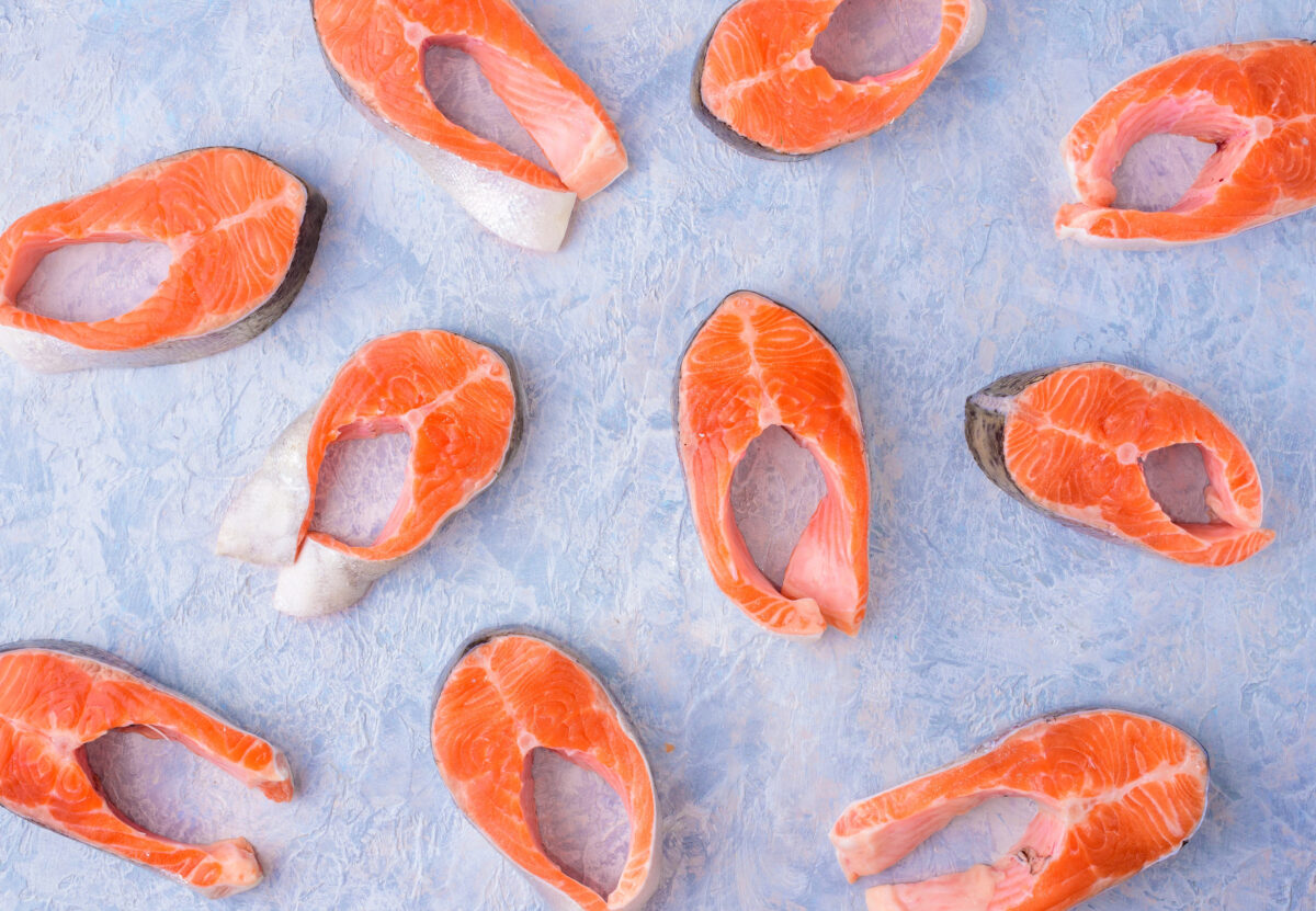 The 8 Foods You Should Never Eat If You Care About Climate Change 2 Fresh uncooked red fish fillet over white