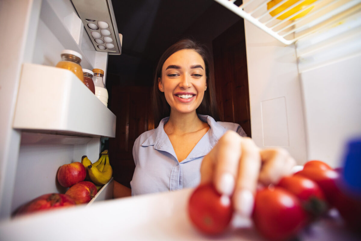 8 Storage Mistakes That Are Ruining Your Food 1 Young woman taking fresh healthy vegetables from refrigerator, view from fridge