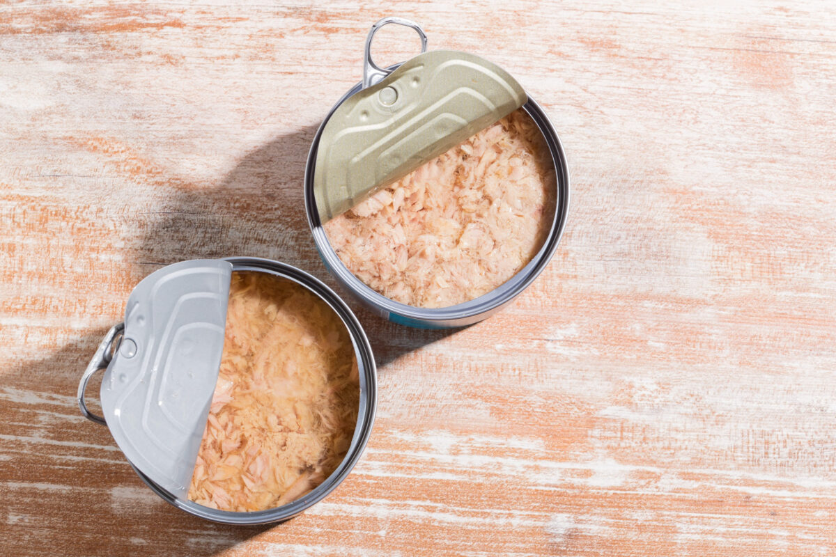 The Worst Canned Foods You Can Buy 3 Open can of tuna on wooden background, close-up image