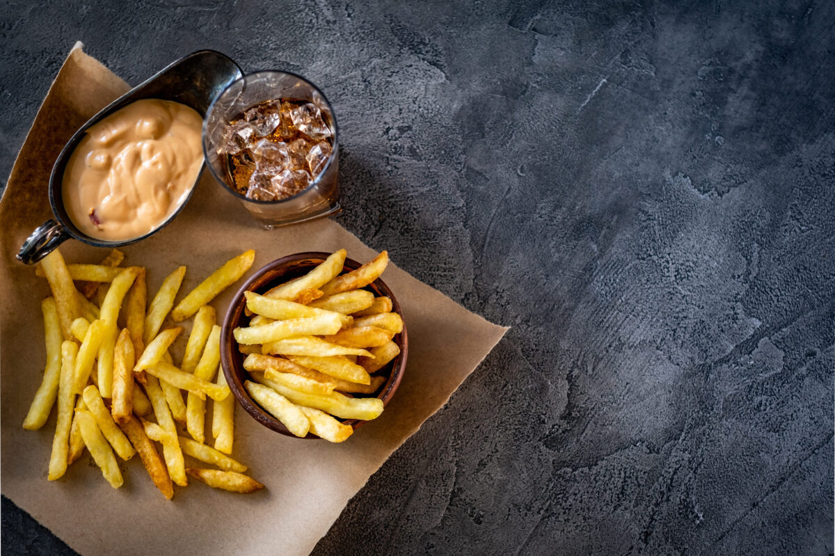 9 Fast Food Dipping Sauces That Can Ruin an Otherwise Good Order 4 French fries with sauce and drink laid on pergament paper