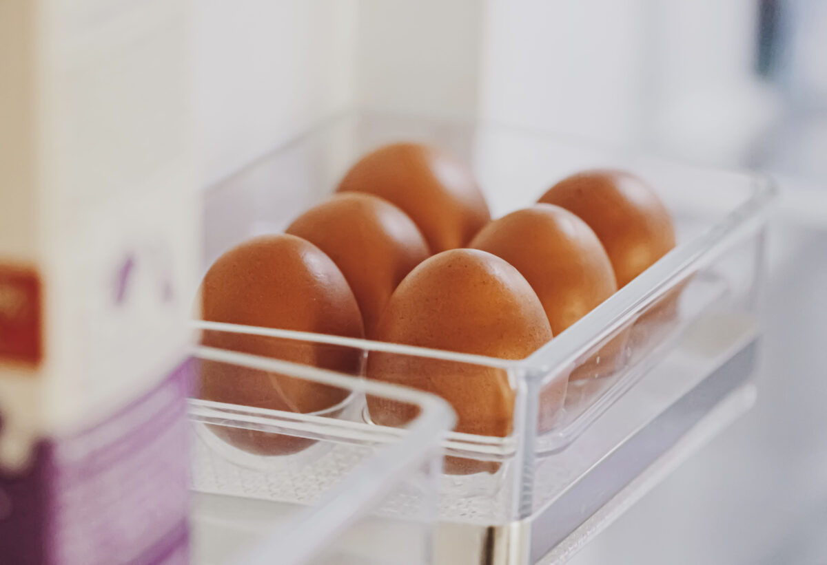 11 Common Mistakes That Are Ruining Your Fried Eggs 4 fresh eggs in refrigerator, dairy product closeup