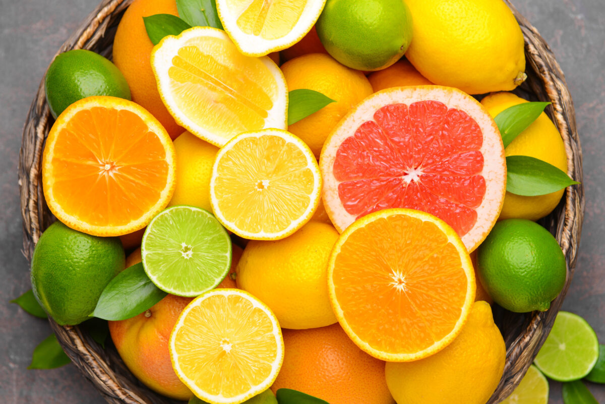 Stop Consuming These 10 Foods If You Want to Improve Your Sleep 3 Different citrus fruits in basket, closeup