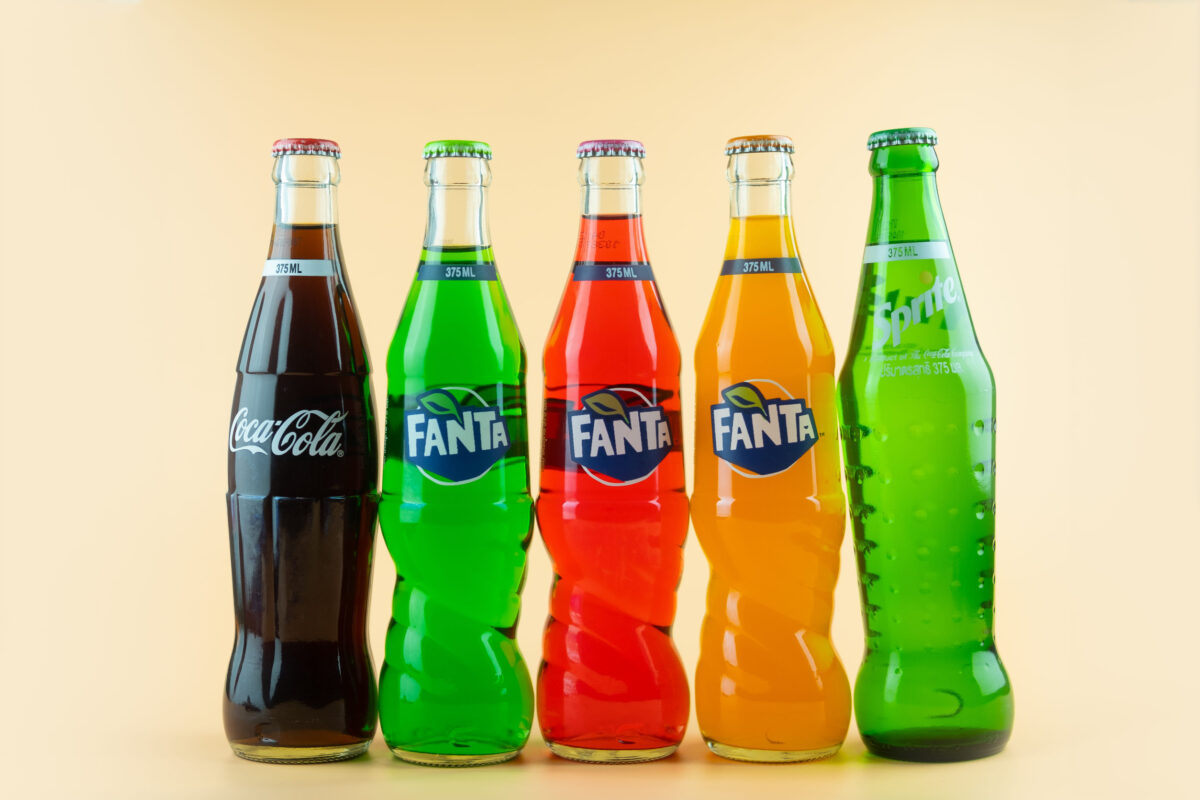 The 8 Worst Foods for Your Bones. What to Avoid for Stronger, Healthier Bones. 1 Samut Prakan, Thailand - March 20, 2021 : Popular soft drink in glass bottle volume 375 ML. such as Coca-Cola, Fanta of three flavour and Sprite on a orange background