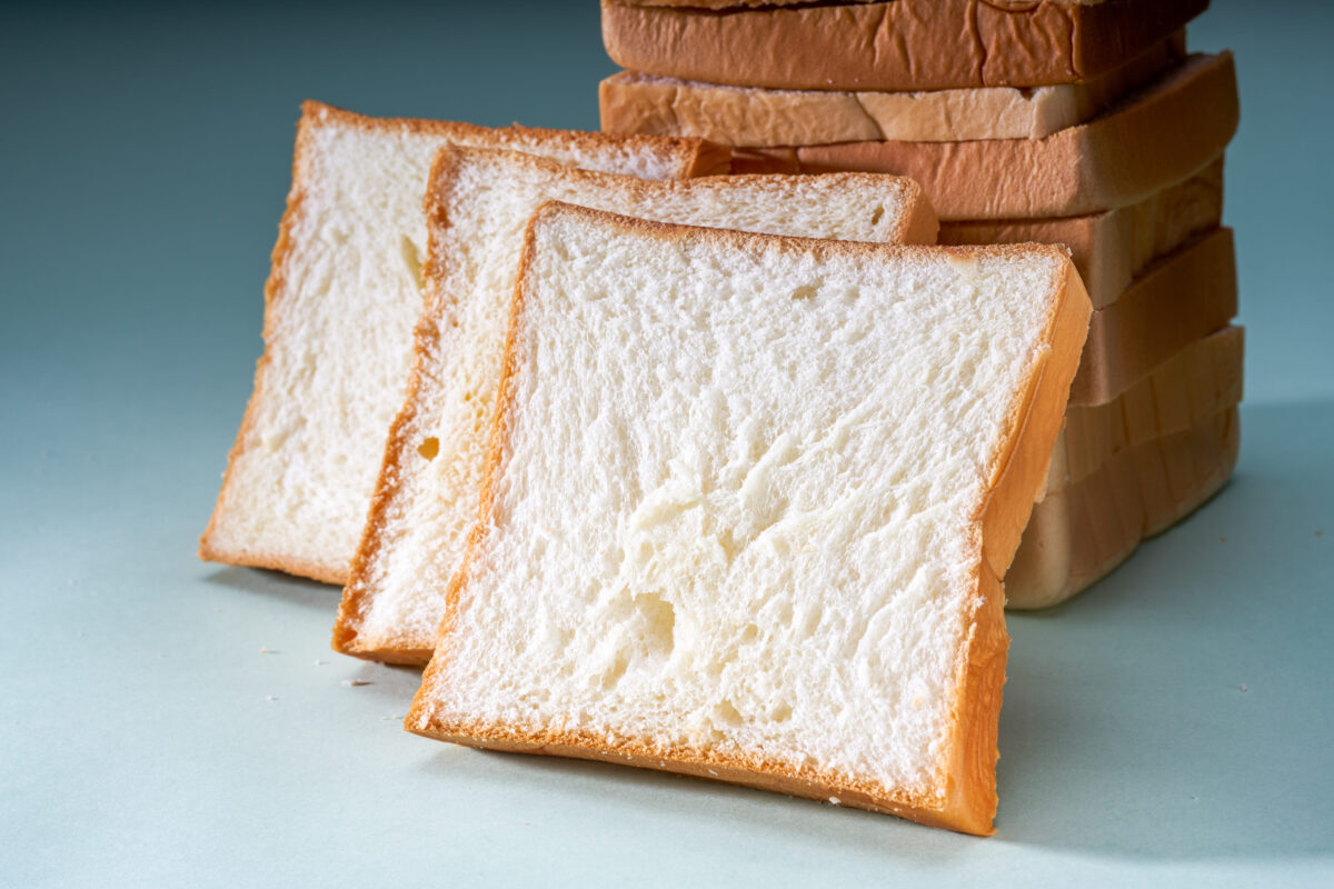 The 9 Most Common Foods That Are Making Your Stress Worse 4 The slices of toast bread filling the picture are spread out on the table