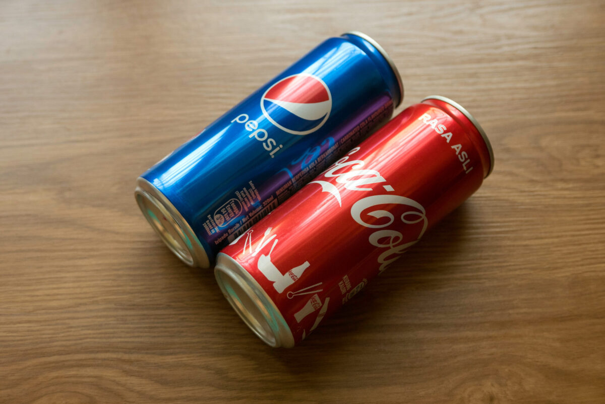 The 10 Worst Foods You Should Never Eat If You Have Diabetes 1 KULIM, MALAYSIA - FEBRUARY 6TH,2021 : Pepsi and Coca-Cola can on wooden background.