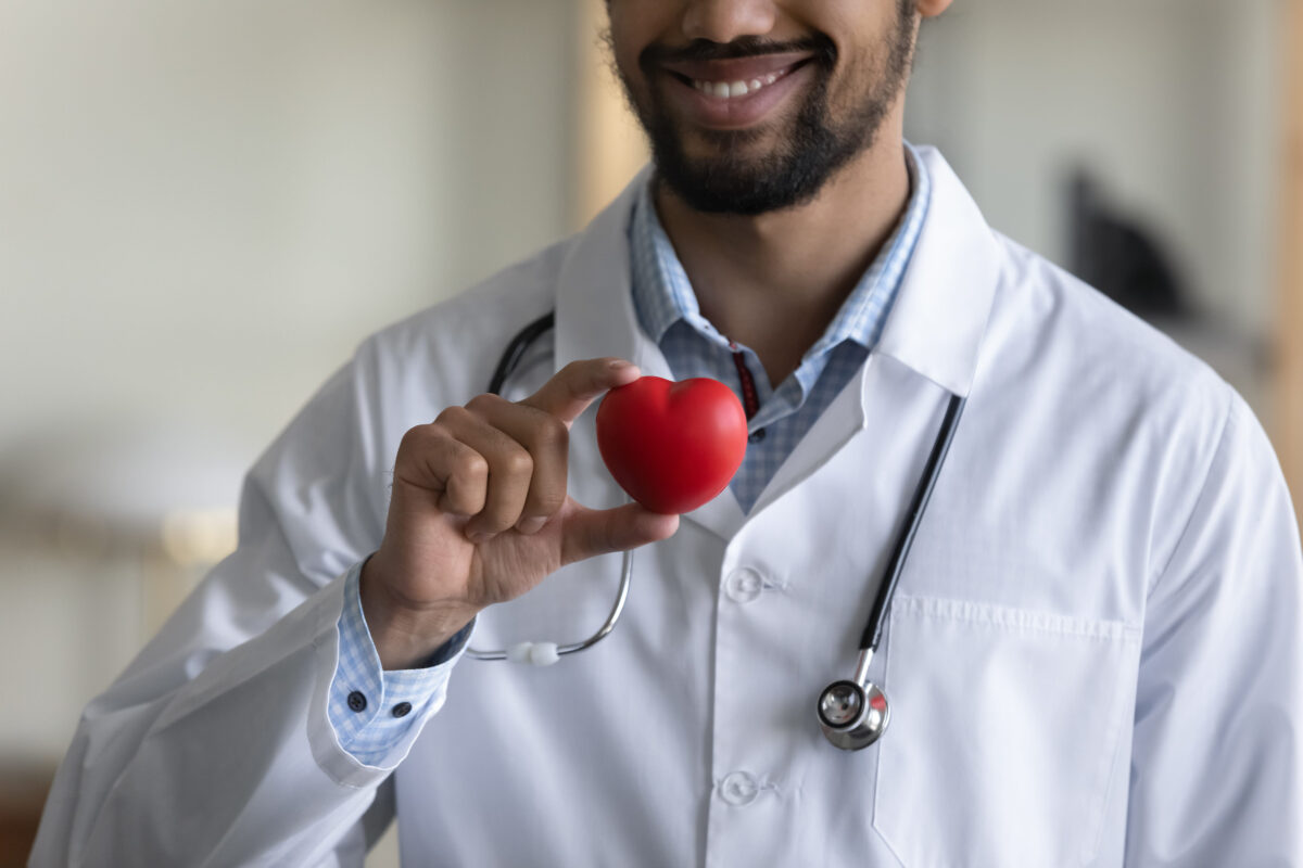 8 Impact of Long-Term Keto Diet on Your Health 2 Close up cropped millennial african ethnicity multiracial male doctor cardiologist holding heart figure in hands, reminding of regular checkup, preventing cardiovascular diseases, healthcare concept.