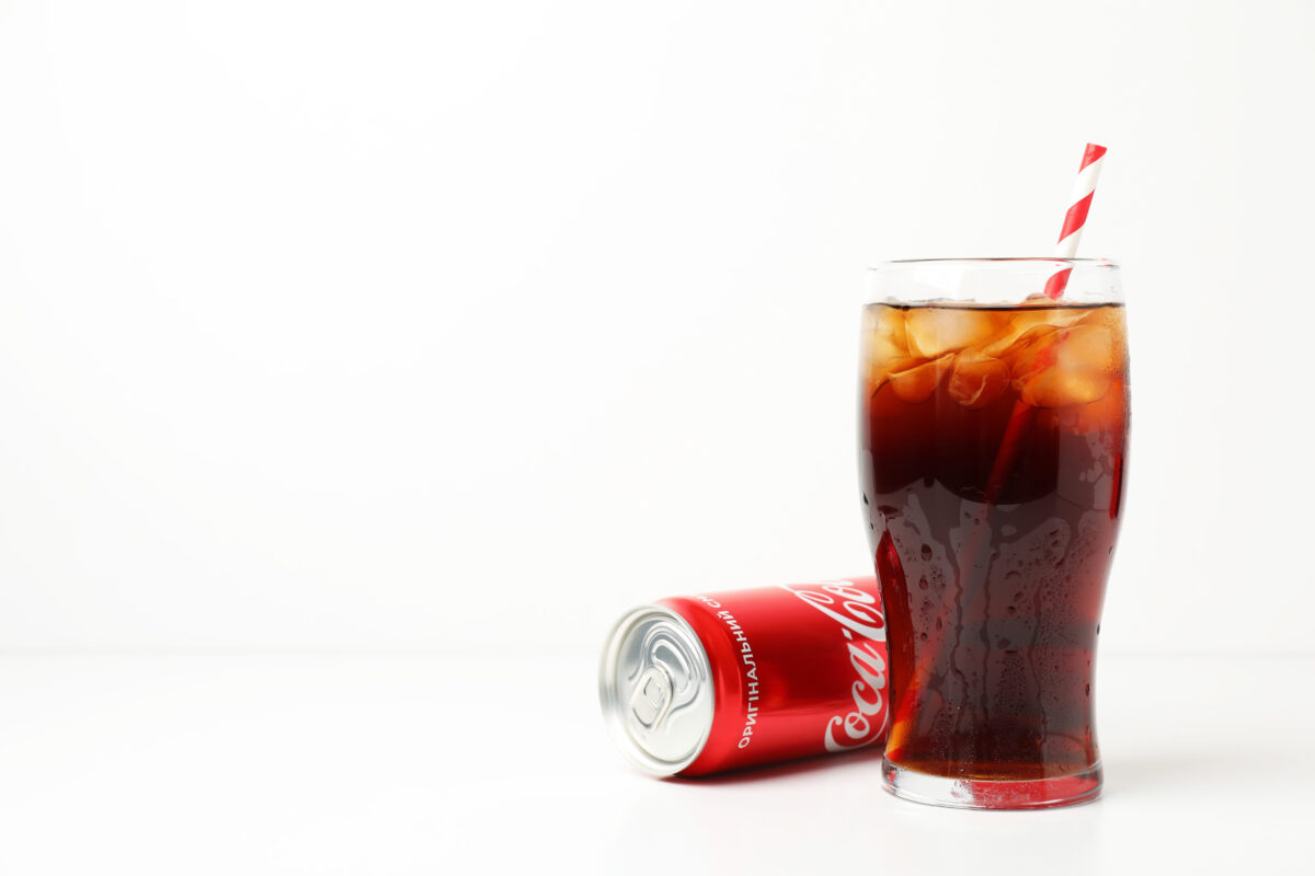7 Sugary Drinks That Are Sabotaging Your Health 1 Odessa, Ukraine - September 23, 2021: Coca - cola can and glass of cola on white table.