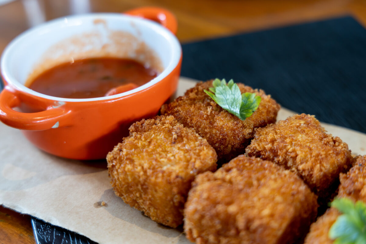 The Caloric Nightmare 1 tomato sauce and cheese bites at the restaurant