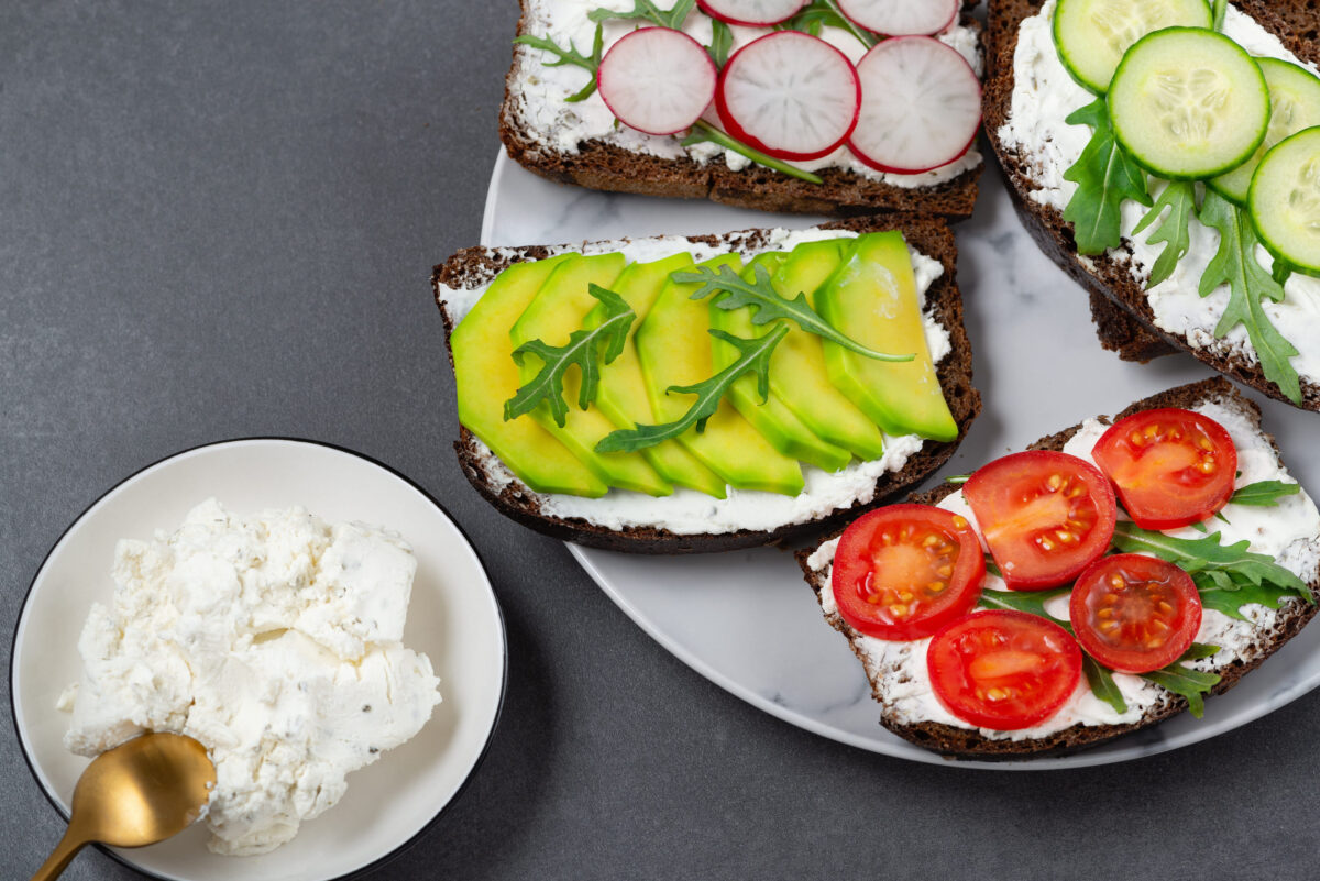 9 Foods You Should Never Bring to a Potluck and What to Bring Instead 1 Healthy sandwiches with white cottage cheese, cucumber, arugula, avocado, tomato