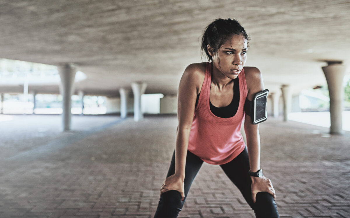 Evaluating the Role of Beauty Standards in Eating Disorders 1 Youve gotta sweat for it. Shot of a sporty young woman taking a break while exercising outdoors.