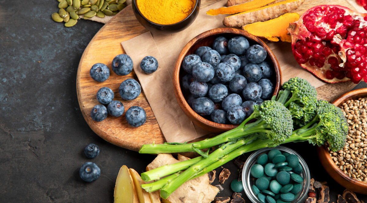 8 Things Nobody Tells You About Superfoods 1 Healthy food clean eating selection on dark background. Balanced diet concept. Superfood assortment. Top view, flat lay, copy space