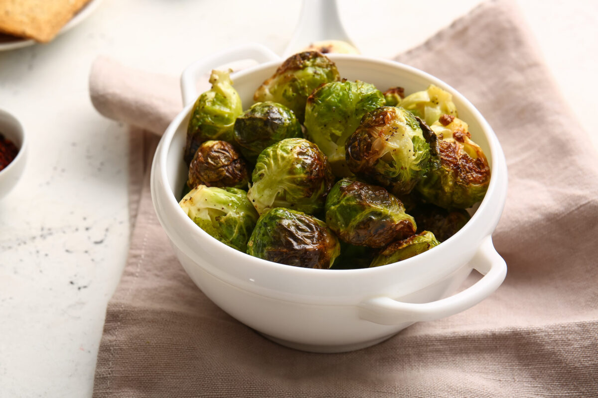 The Most Hated Thanksgiving Side Dishes 4 Pot with tasty roasted Brussels cabbage on light background