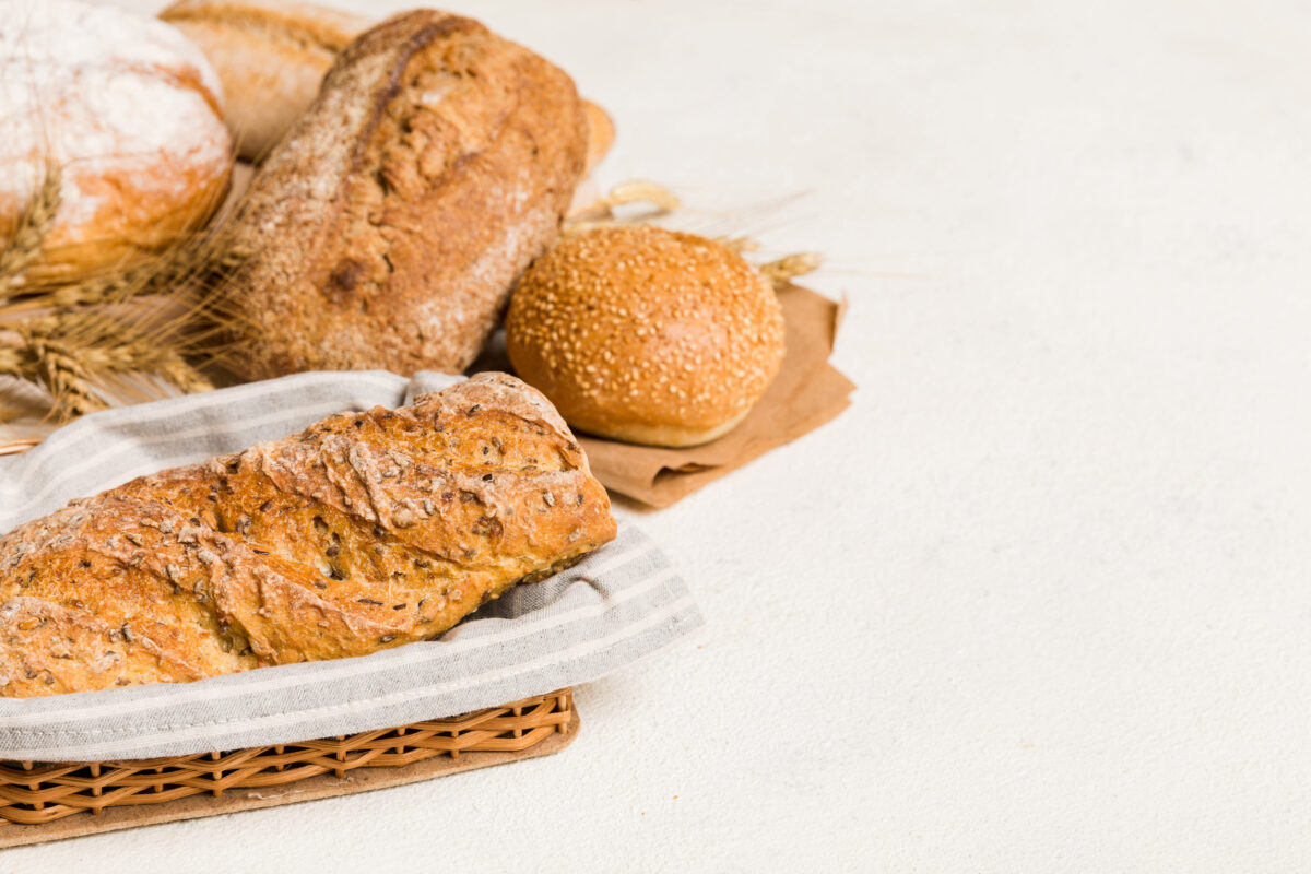The Secret Ingredient in These 6 Popular Foods That Could Be Triggering Your Allergies 1 Homemade natural breads. Different kinds of fresh bread as background, perspective view with copy space.