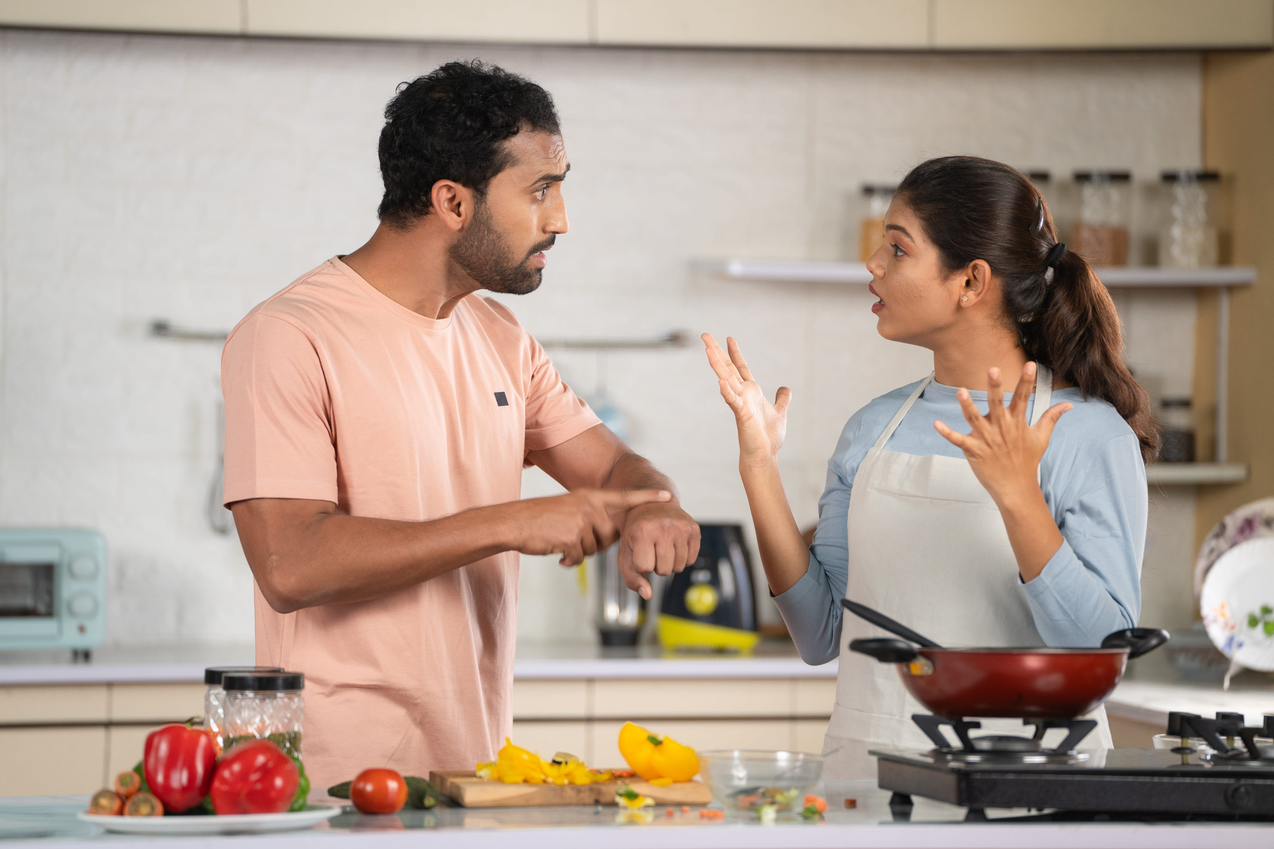 11 Toxic Relationship Patterns Divorced Women Refuse to Survive Again 3 Indian Angry Husband arguing with wife while cooking at kitchen due to hungry - concept of family problems, relationship dispute and misunderstanding