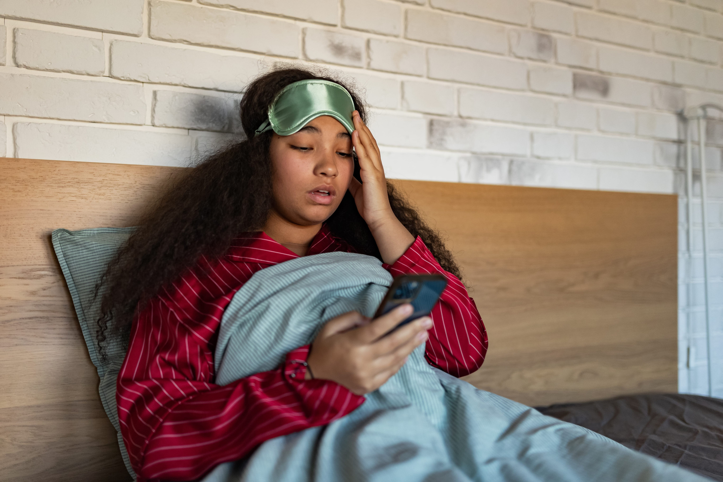 7 Shocking Ways Heartbreak Changes People Permanently 2 Woman setting alarm before going to sleep. Concept of sleep