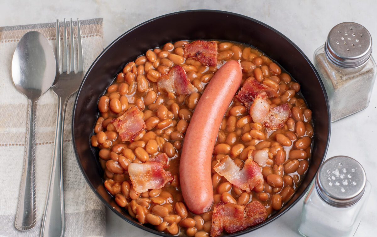 10 Once-Popular Foods People Stopped Eating and Why They Fell Out of Favor 1 bacon with a hot dog served on baked beans