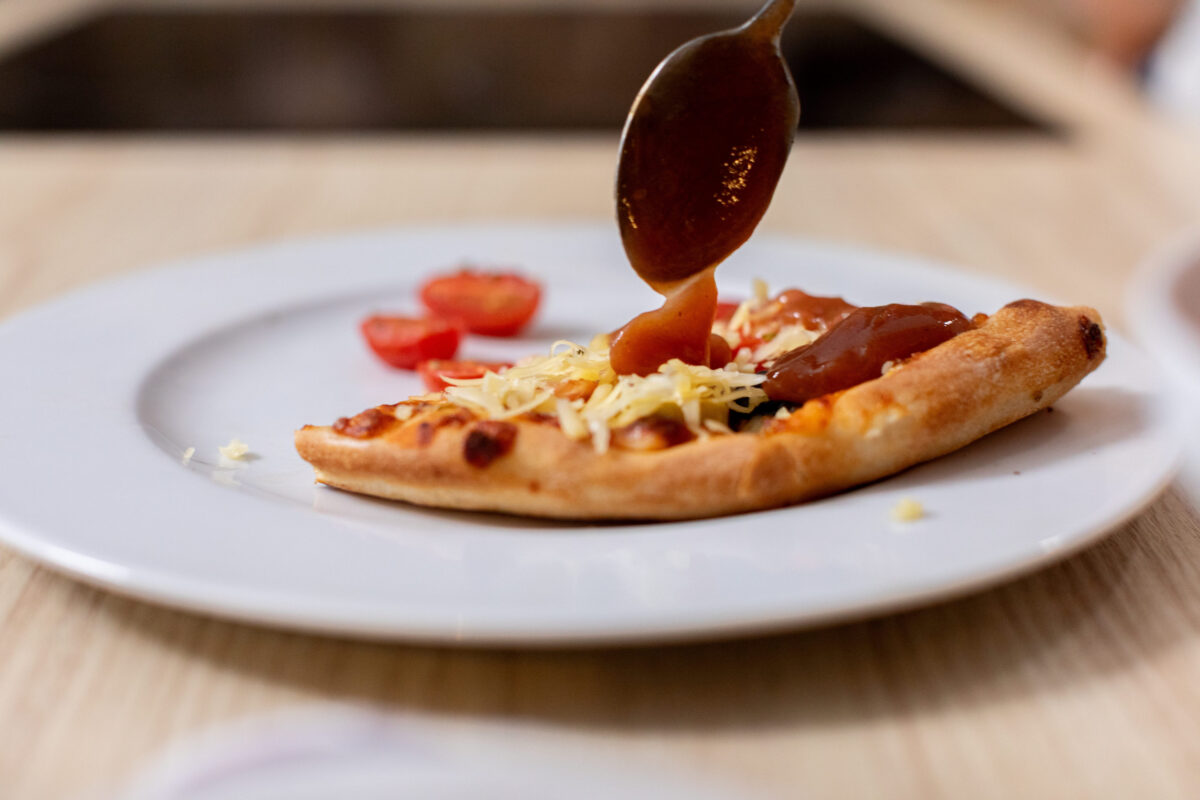 11 The Worst Pizza Toppings That Should Be Banned from Your Slice 3 A Truly Delicious and Flavorful Pizza Served with Exquisite Sauce and Fresh Ingredients on a Plate