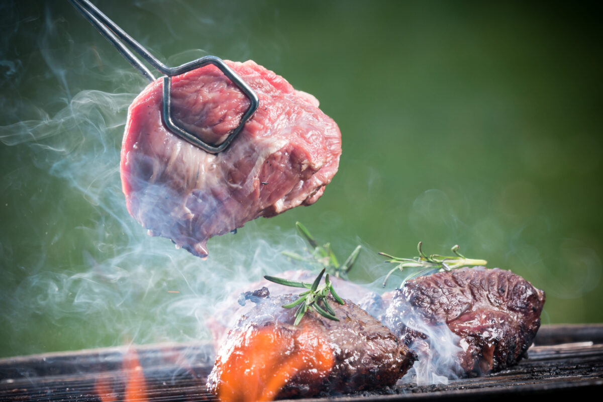 10 Steak Grilling Mistakes That Can Ruin Dinner Fast 3 Grilled beef steaks on the grill, close-up