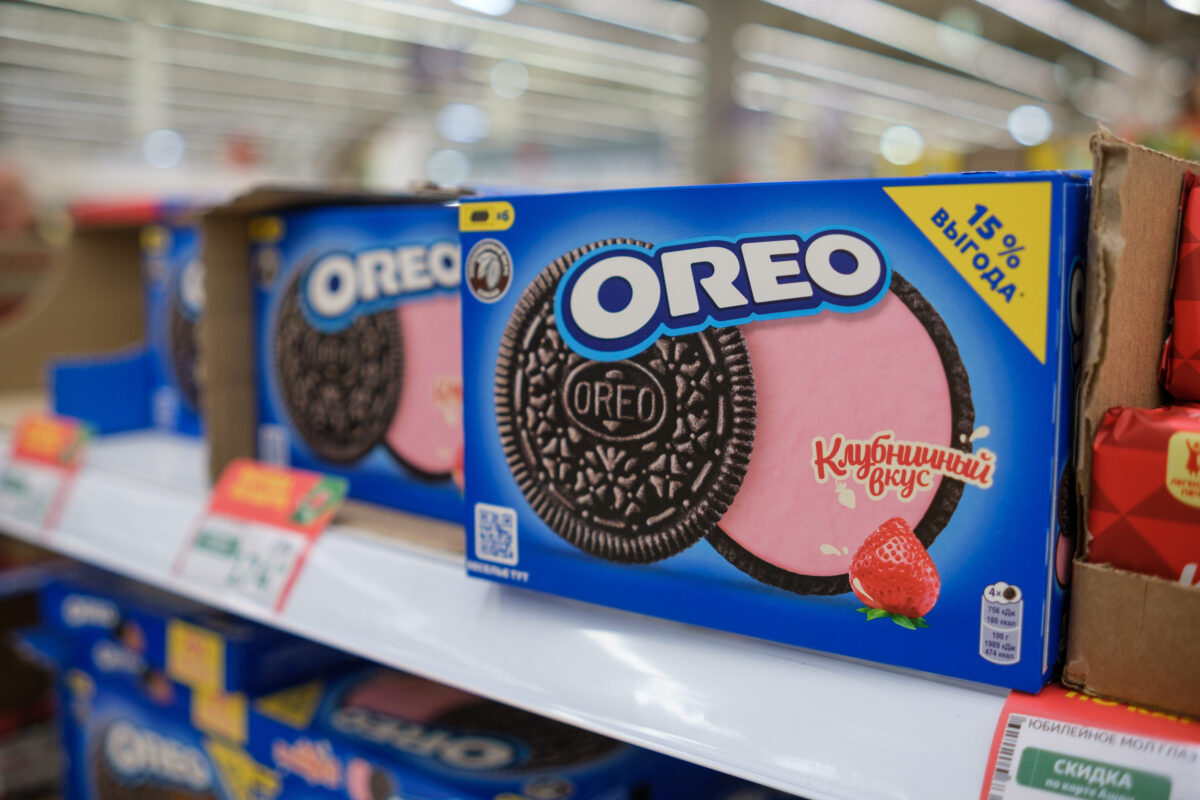These 9 Food Companies Are Ruining the Environment. Stop Buying From Them 2 Brightly Packaged Cookies With Strawberry Flavor on Store Shelf in a Grocery Aisle