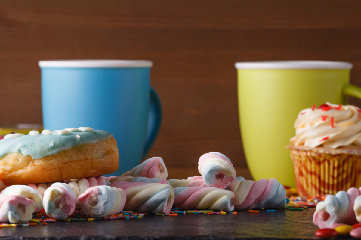 The 10 Worst Foods You Could Eat for Your Skin and What You Should Choose Instead 1 Fun sweet frame on slate black background for text placement. Top view